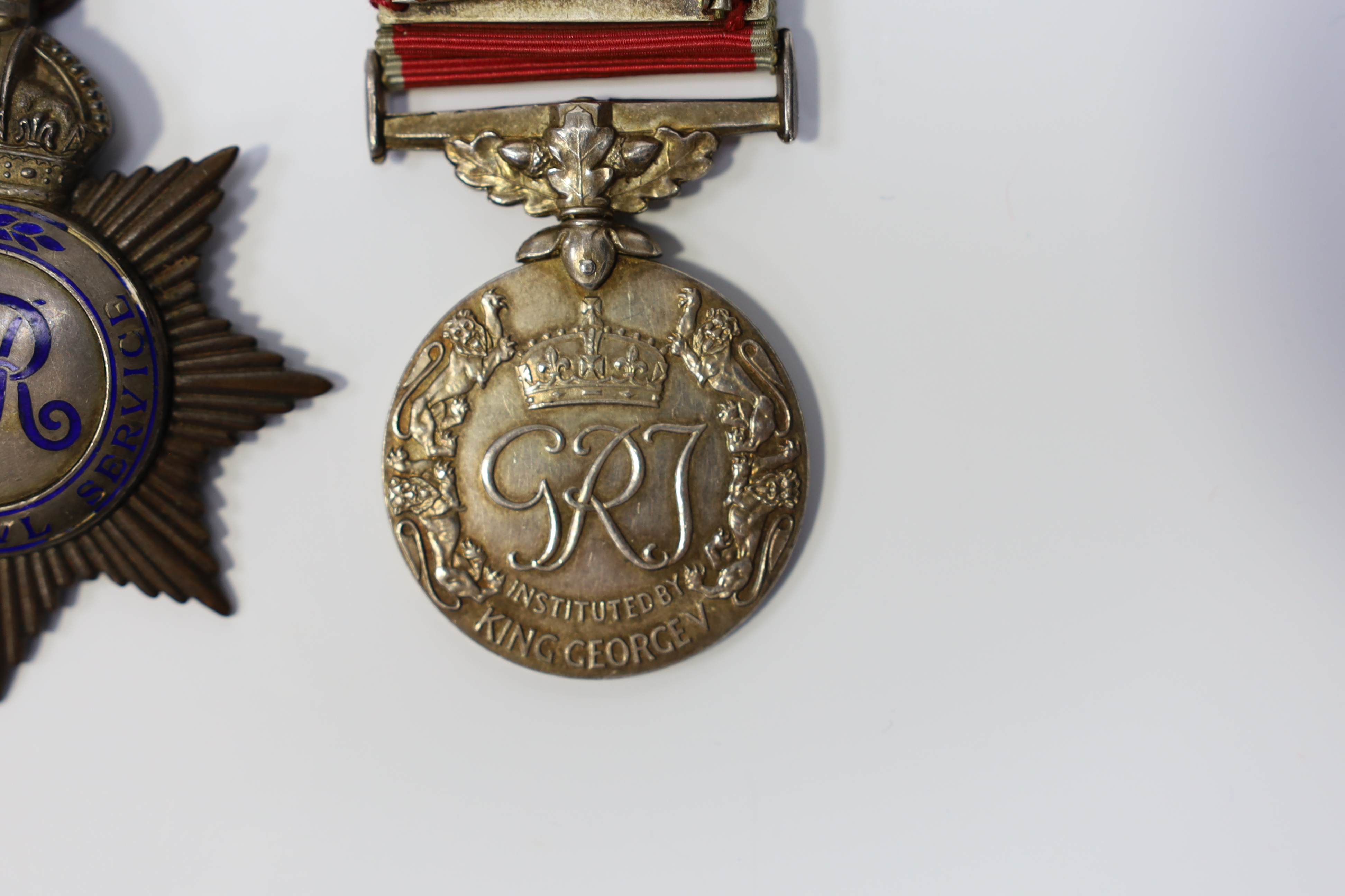 A cased George VI civil issue British Empire medal, awarded to George Watson, together with a cased George V Imperial Service Medal awarded to Richard Braid (2). Condition - fair to good